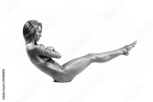 sports naked girl posing on a white background