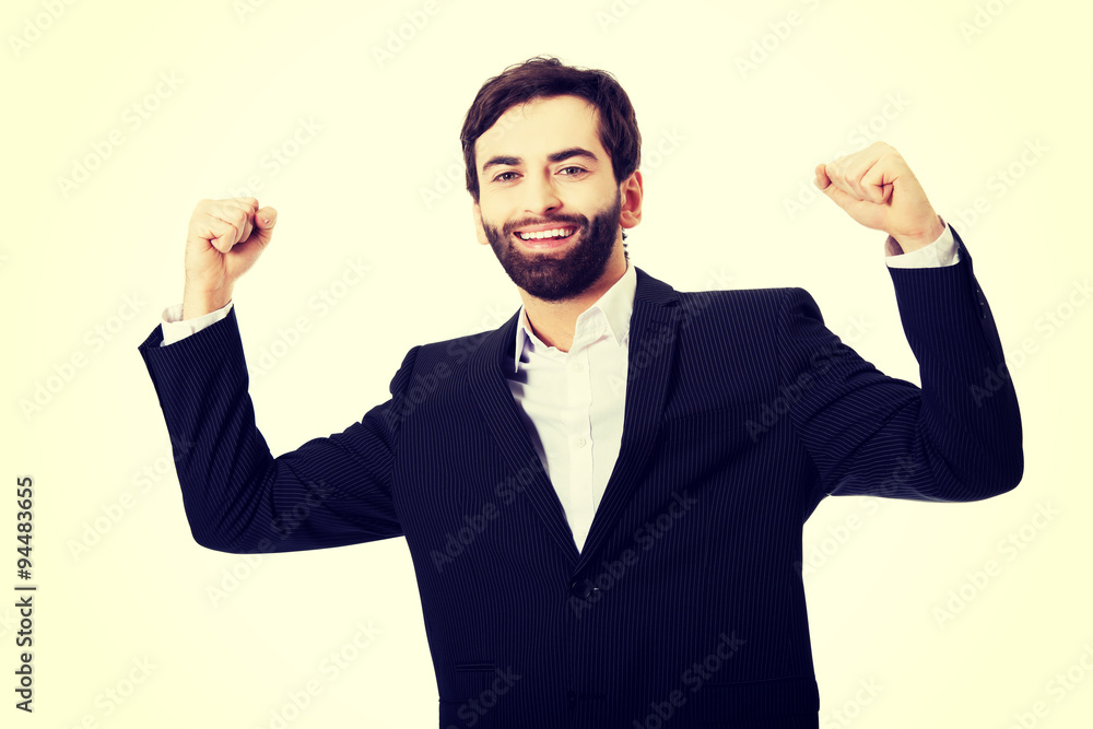 Businessman making fists in a winner gesture. Businessman making fists in a winner gesture.