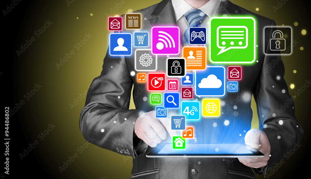 Business man using tablet PC with social media icon set