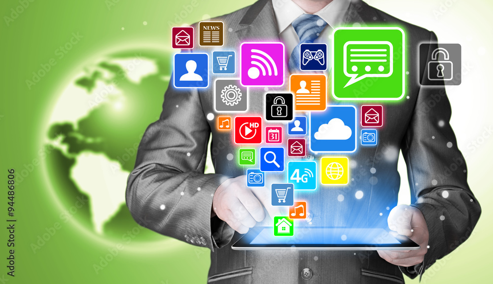 Business man using tablet PC with social media icon set Business man using tablet PC with social media icon set