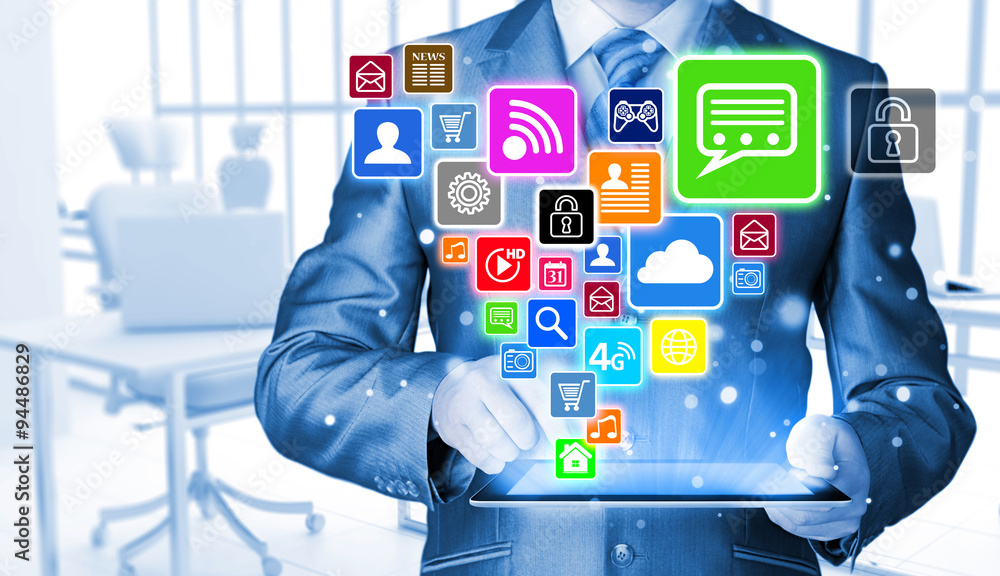 Business man using tablet PC with social media icon set Business man using tablet PC with social media icon set