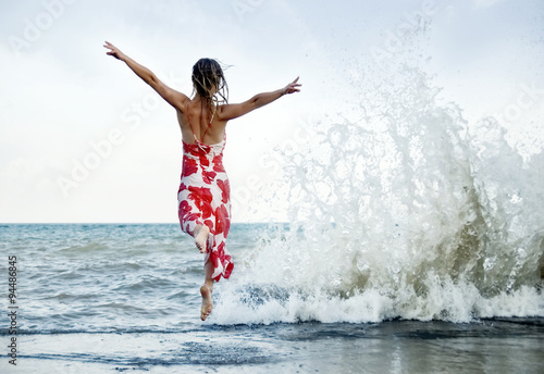 Woman jumping on the beach © nickolya