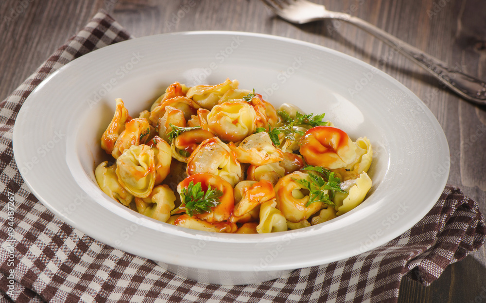 Ravioli pasta with tomato sauce and fresh herbs. Ravioli pasta with tomato sauce and fresh herbs.