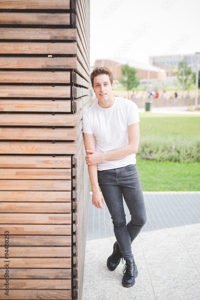 Young handsome caucasian brown hair man ballet dancer posing and dancing in the street of the city - movement, dancing, elegance concept Young handsome caucasian brown hair man ballet dancer posing and dancing in the street of the city - movement, dancing, elegance concept