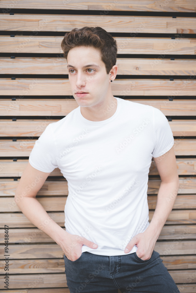 Young handsome caucasian brown hair man ballet dancer posing and dancing in the street of the city - movement, dancing, elegance concept Young handsome caucasian brown hair man ballet dancer posing and dancing in the street of the city - movement, dancing, elegance concept