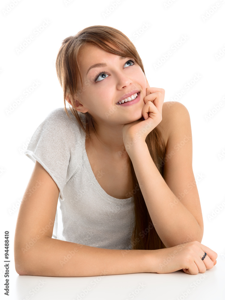 Portrait of a beautiful young smiling girl on a light background. Portrait of a beautiful young smiling girl on a light background.