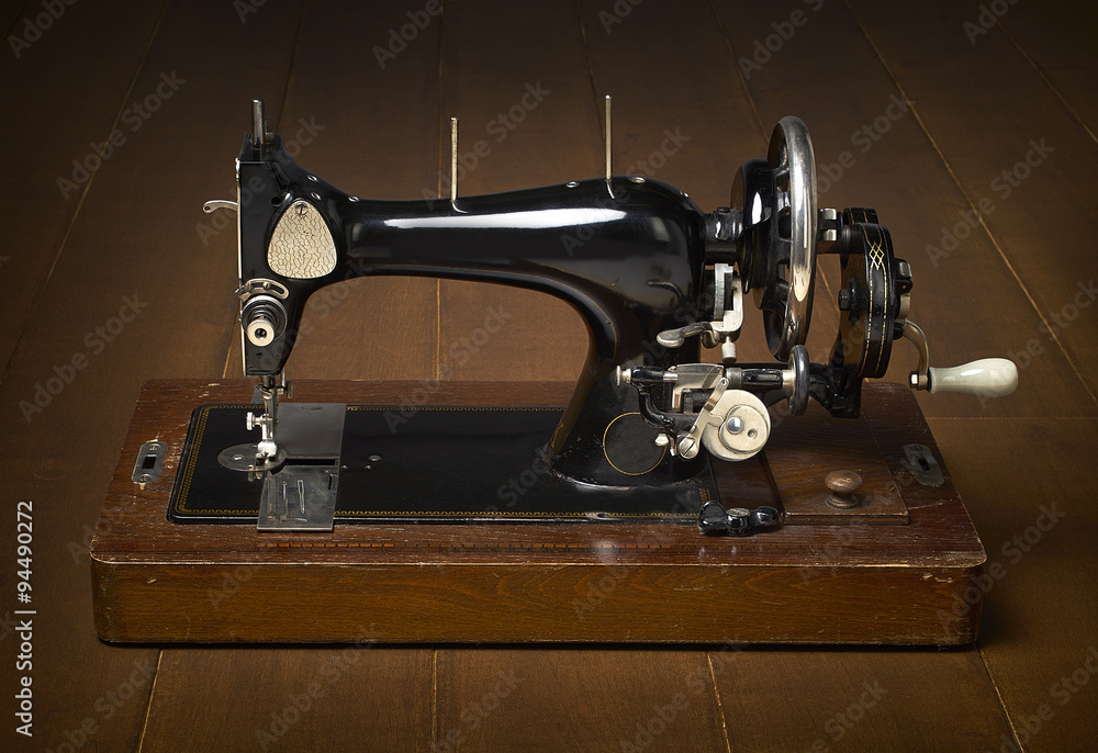 sewing machine on a wooden background