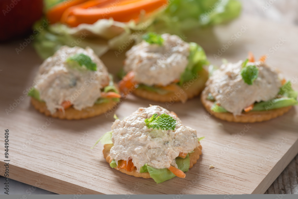 Delicious crackers with tuna salad topping. Delicious crackers with tuna salad topping.