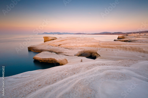Coastal scenery with pale volcanic rocks near Sarakiniko beach in Milos island, Greece. photo