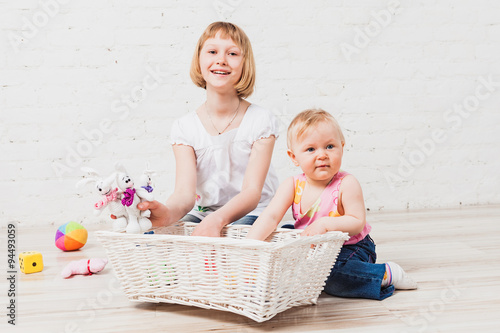 Happy children playing with soft toys photo