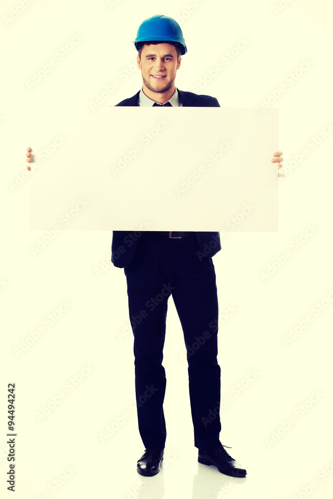 Businessman enginner holding empty banner. Businessman enginner holding empty banner.