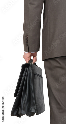 Businessman with suitcase, rear view
