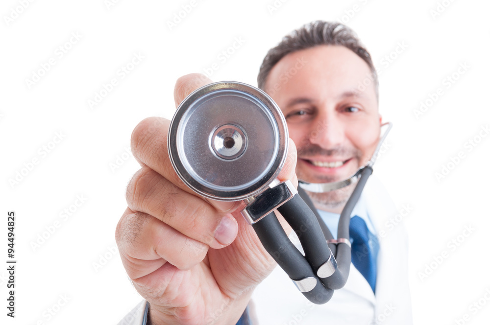 Medic or doctor holding stethoscope with focus on it Medic or doctor holding stethoscope with focus on it
