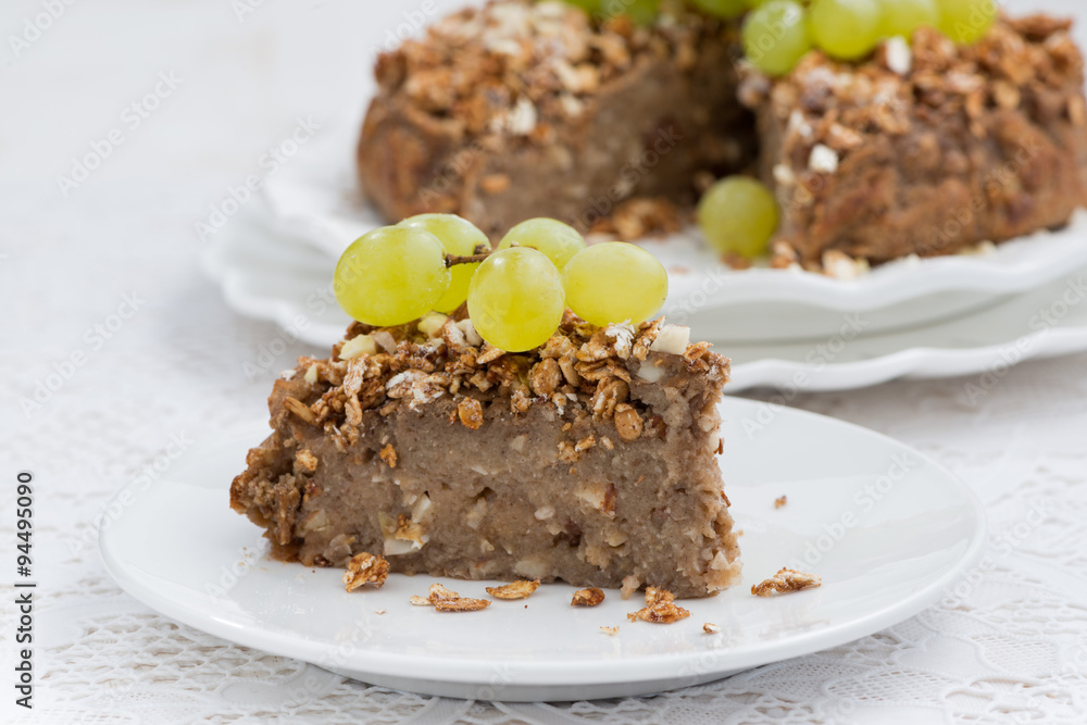 piece of delicious nut pie with grapes on plate piece of delicious nut pie with grapes on plate