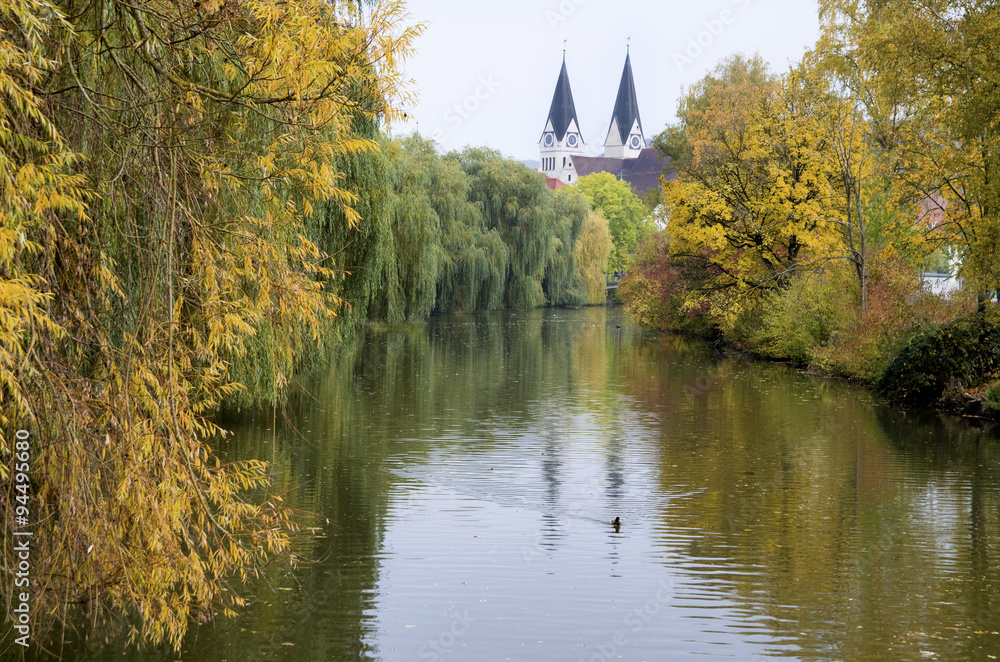 Almuehl river in Eichstatt during autumn.Cathedral of Eichstaett in fall, Bavaria,Germany Almuehl river in Eichstatt during autumn.Cathedral of Eichstaett in fall, Bavaria,Germany