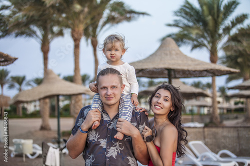 Family mother, father and child portrait on the beach © kuzmichstudio