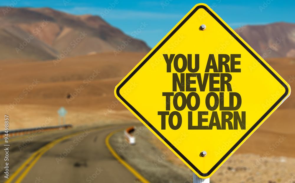 You Are Never Too Old to Learn sign on desert road
