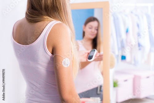 Diabetic girl with glucose meter