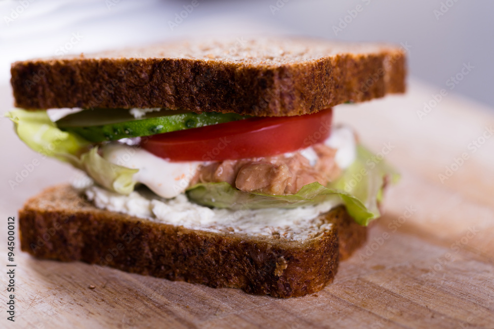 Fresh homemade grilled tuna sandwich on wood Fresh homemade grilled tuna sandwich on wood