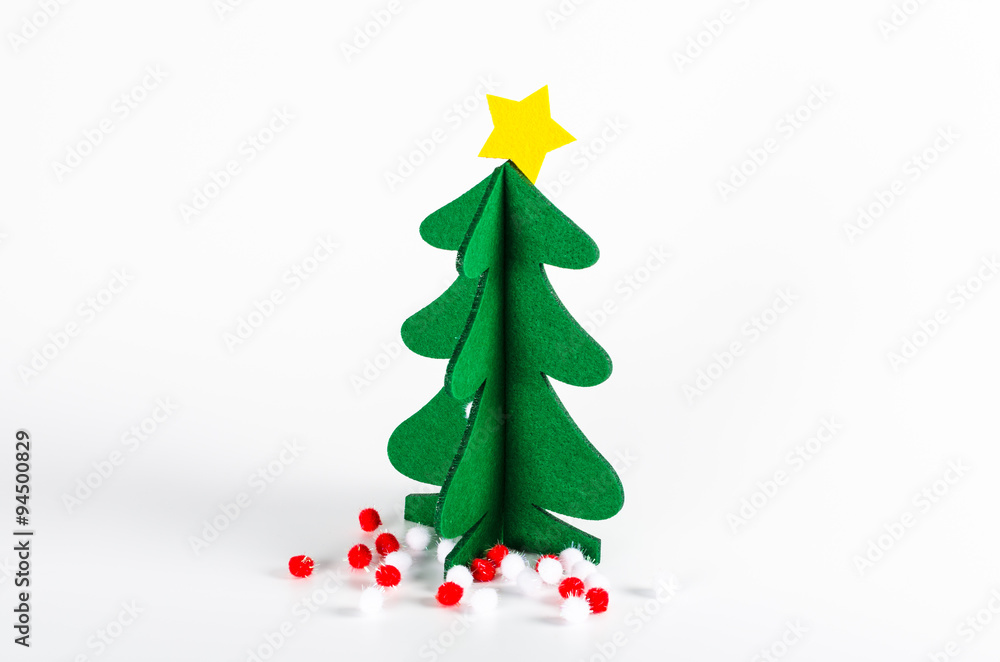 Small green Christmas tree with a golden star decoration isolate Small green Christmas tree with a golden star decoration isolate