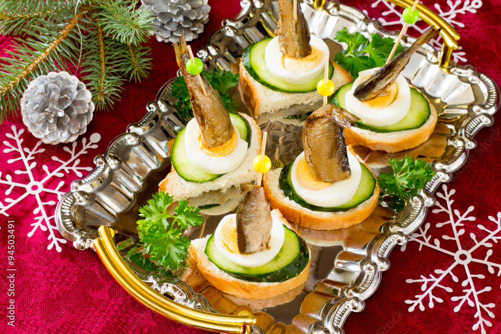 Canapé with fresh cucumber sprats and New Year's Eve