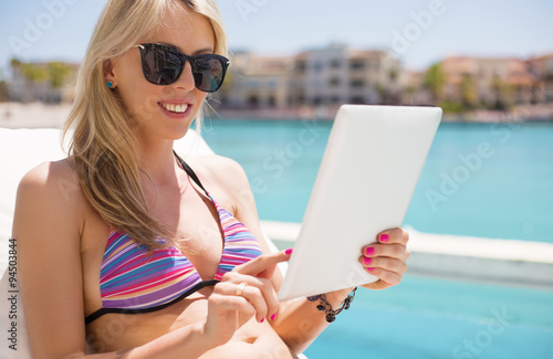 Woman reading ebook on tablet computer