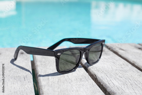Sunglasses by the pool photo
