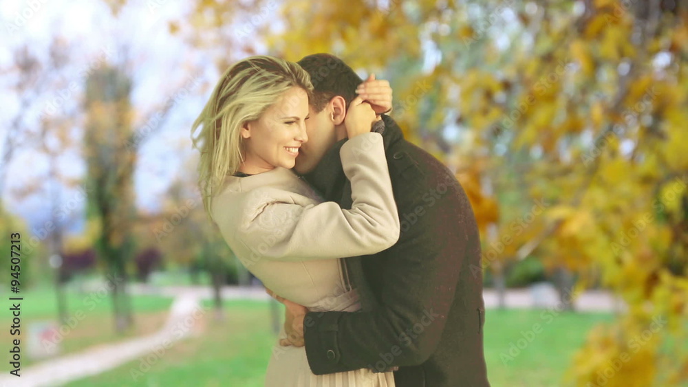 Man and woman kissing beautiful in autumn park outdoor. Man and woman kissing beautiful in autumn park outdoor.