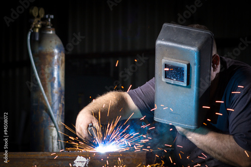 Worker welding theiron photo