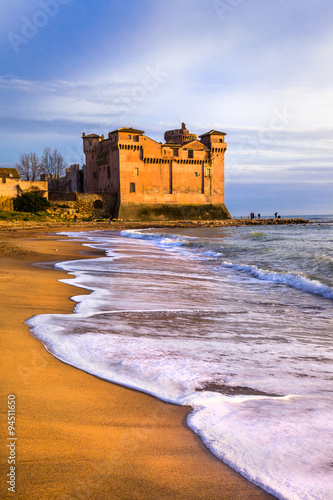 castle over sea and sunset. Santa Severa, Italy photo