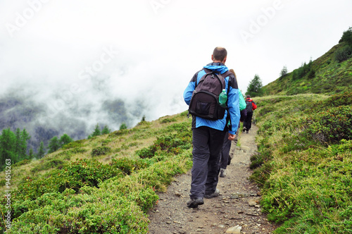 Tourists hiking in mountains