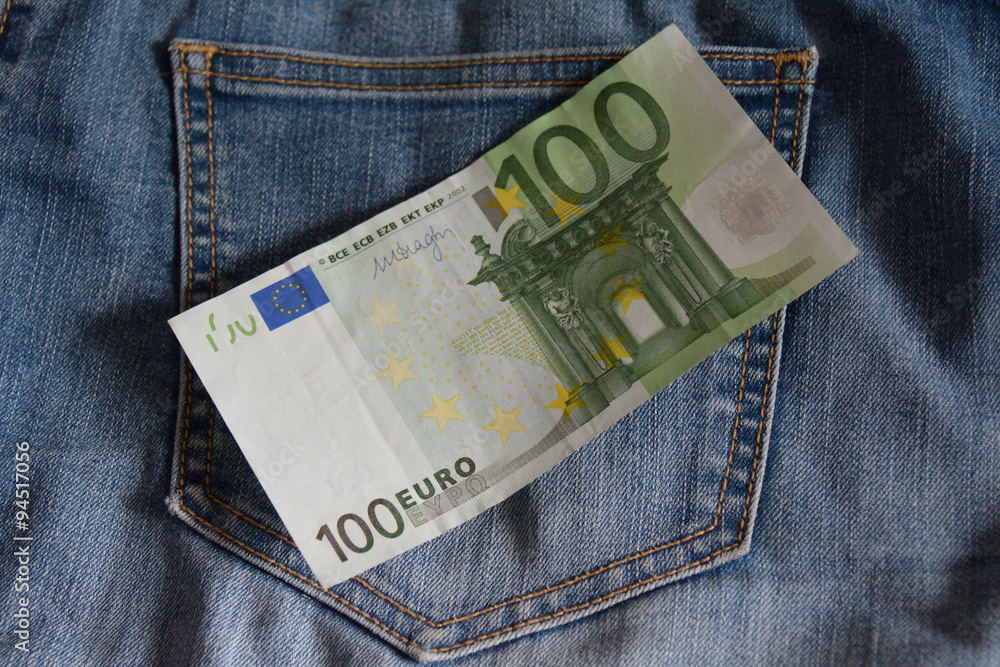100 euros lying over the jeans pocket Stock Photo | Adobe Stock