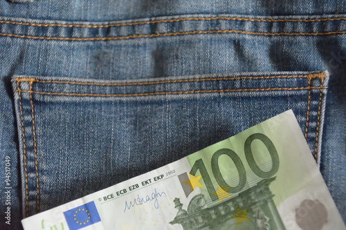 hundred euro note over the jean fabric