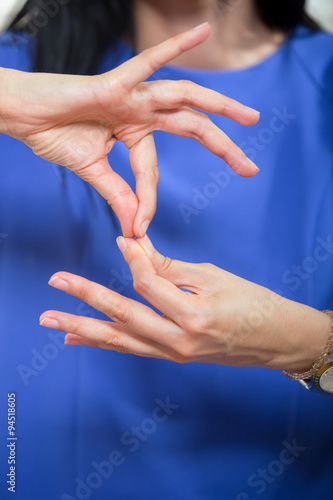 Deaf woman using sign language  close up