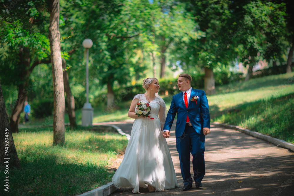 Fototapeta premium beautiful young couple stand on background forest