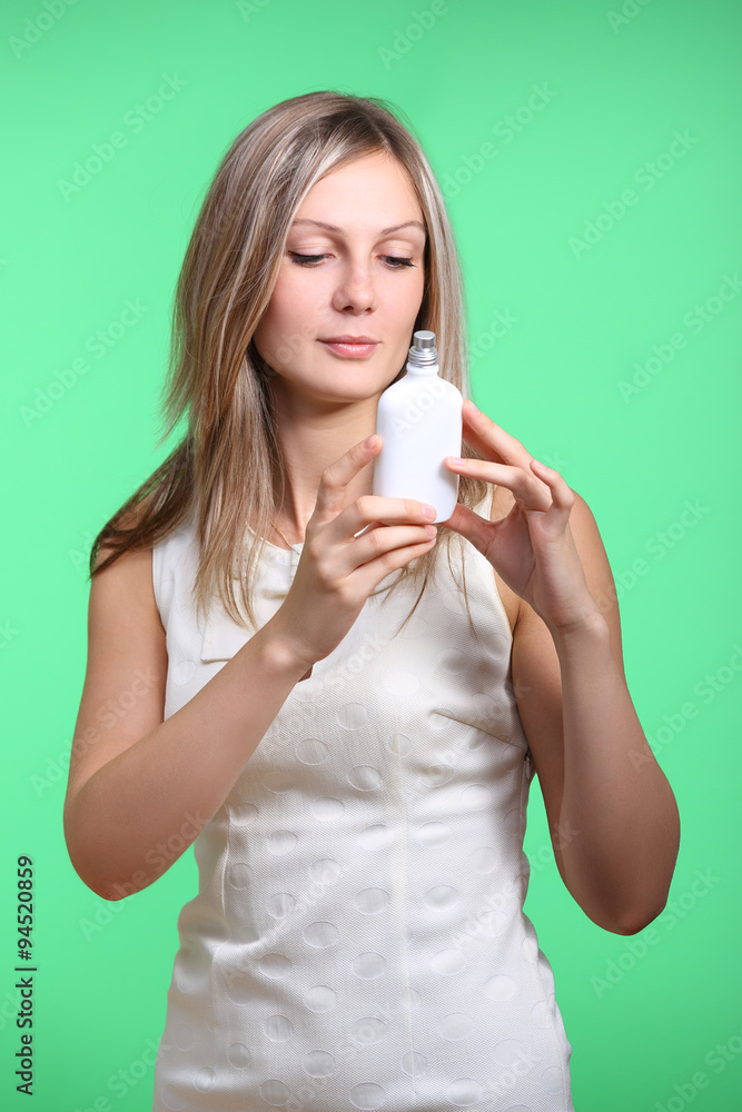 Beautiful brunette smelling perfume Beautiful brunette smelling perfume