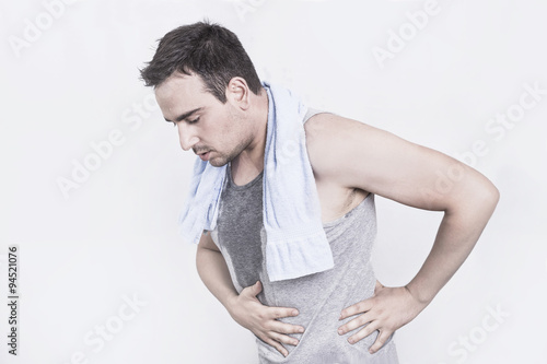 Man after a workout having stomachache 