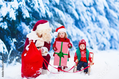 Kids and Santa with Christmas presents