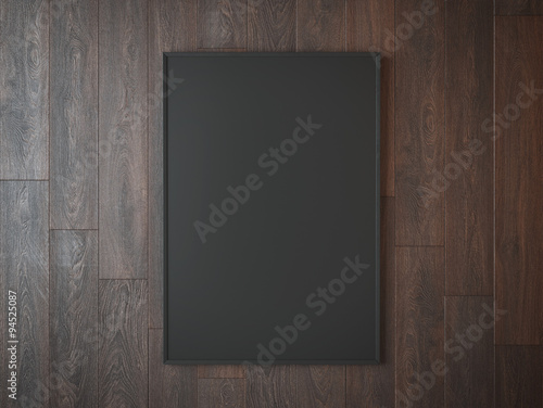 Black picture frame on wooden wall