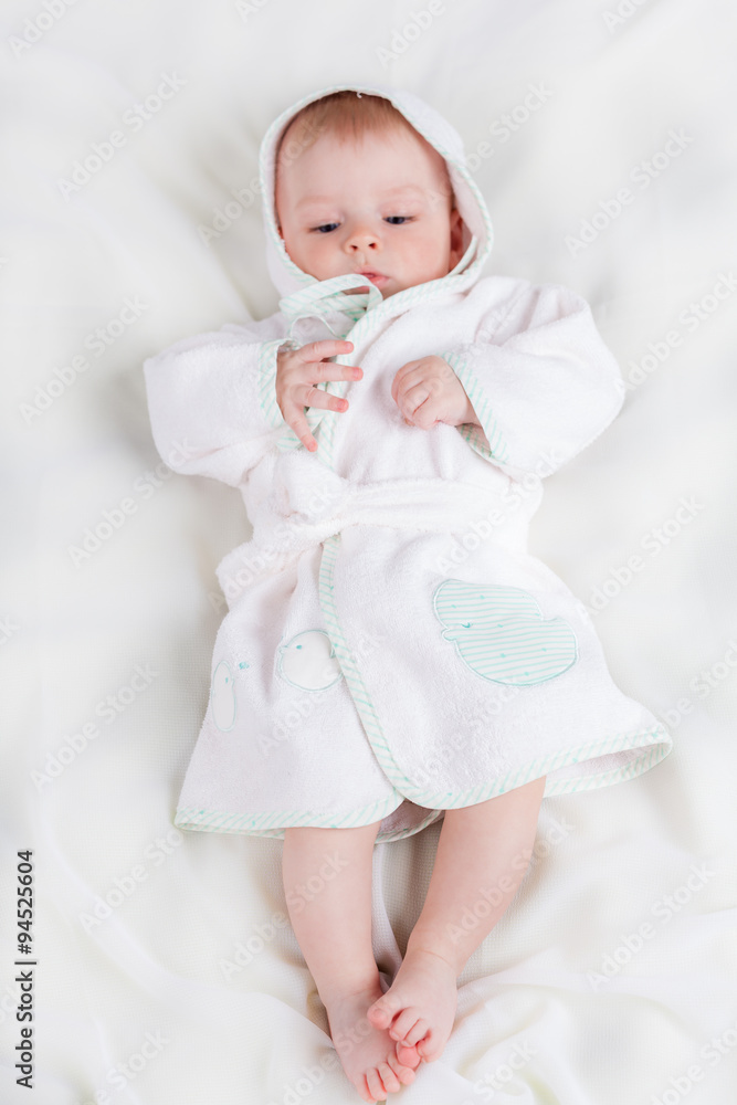 Cute little boy wearing in white bathrobe Cute little boy wearing in white bathrobe