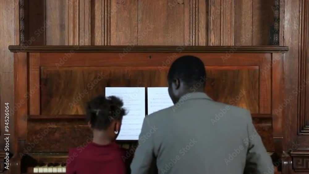 Father and daugther playing piano Father and daugther playing piano