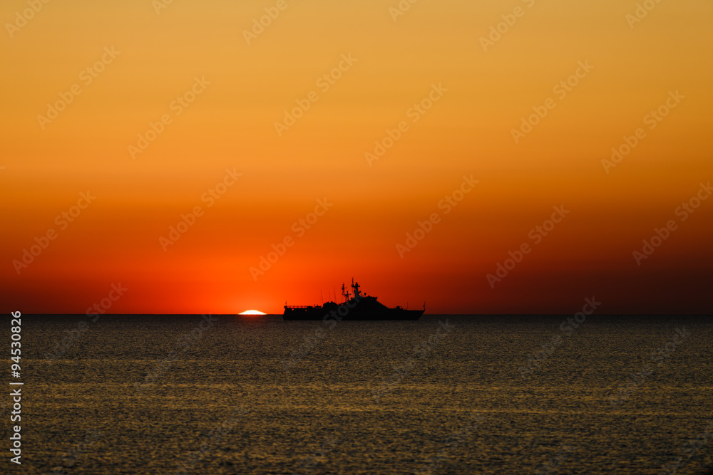 russian coast guard ship at sunset