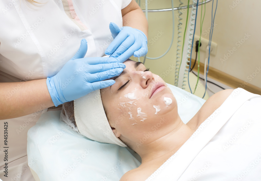 woman passes treatment mask facial at the beauty salon woman passes treatment mask facial at the beauty salon