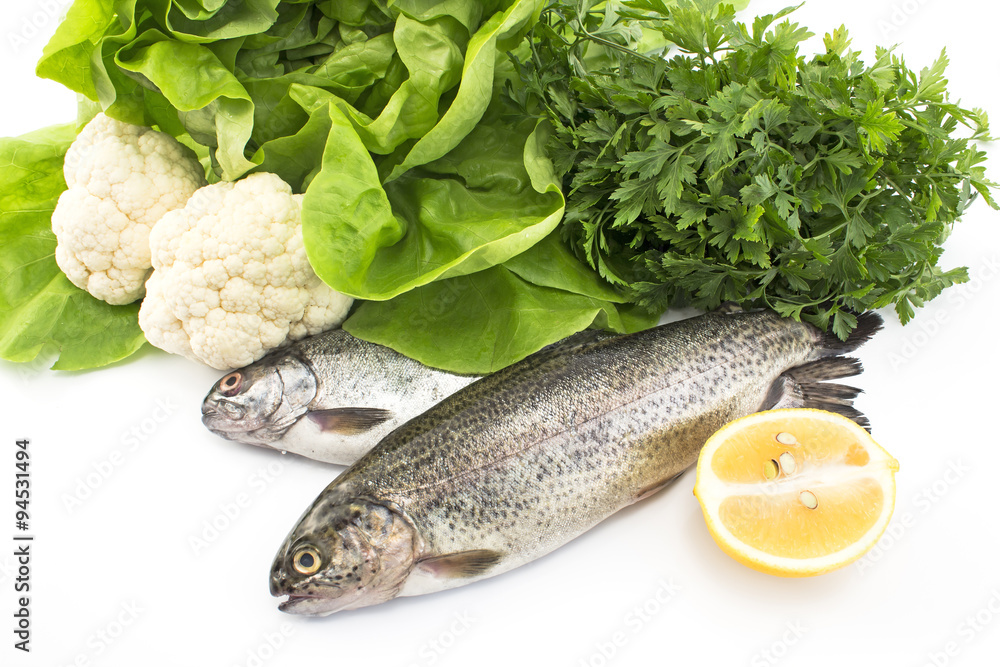 Two rainbow trout with vegetables and lemon Two rainbow trout with vegetables and lemon