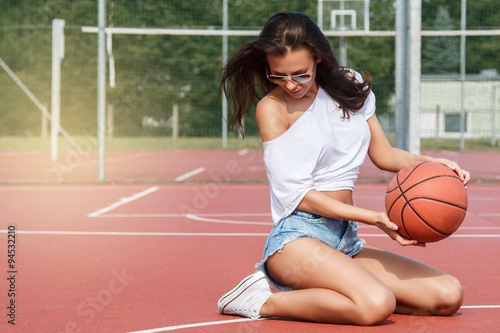 Woman on basketball playground © blackday