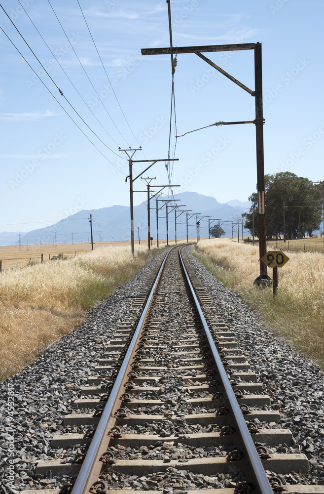 Single railroad line passing through the wheatlands of the Swartland region South Africa