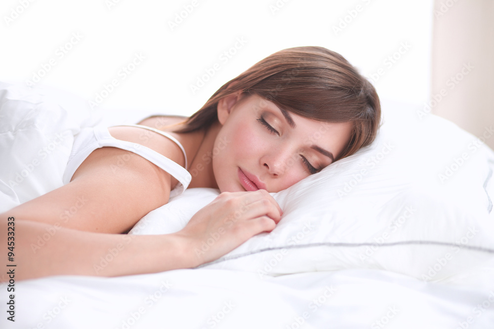 Beautiful girl sleeps in the bedroom, lying on bed Beautiful girl sleeps in the bedroom, lying on bed