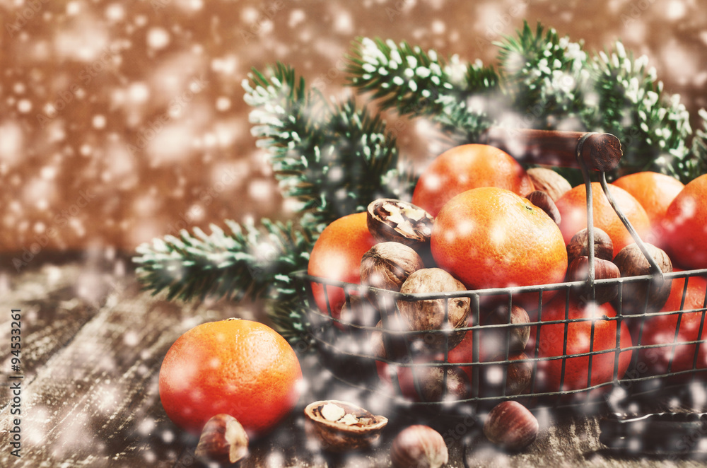 Christmas decoration with tangerines and falling snow Christmas decoration with tangerines and falling snow