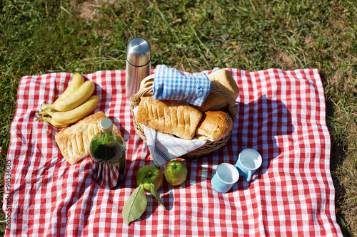 Basket with food,bread and wine on picnic
