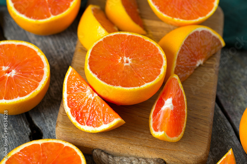 red oranges on wooden surface